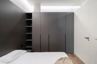 a bedroom with a bed and a black headboard at Cosy Loft's Valencia in Catarroja