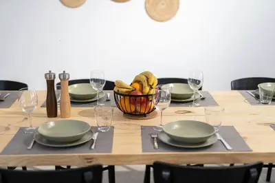 a wooden table with a basket of bananas on it at Maison avec piscine à Valencia in Valencia