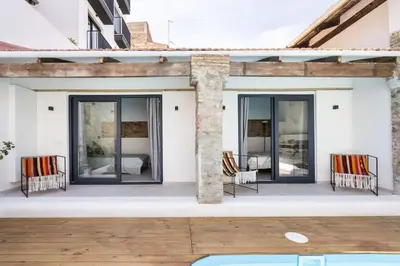 two chairs on the patio of a house at Maison avec piscine à Valencia in Valencia