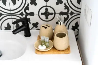 a bathroom counter with two soap dispensers and a sink at Maison avec piscine à Valencia in Valencia