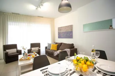 a living room with a table and a couch at SingularStays Mar44 in Valencia