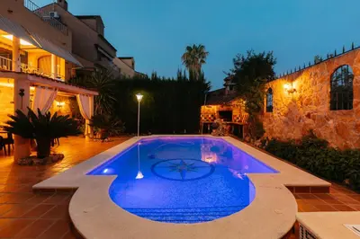 a swimming pool in the middle of a yard at chalet, villa rodeada de naturaleza piscina a doce klm de Valencia y 7 del aeropuerto in Valencia