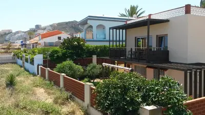 a house with a fence in front of it at Casa Catinca Cullera - Beach House On the Dune in Cullera
