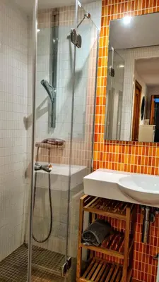 a bathroom with a shower and a sink at Apartmán pri mori in El Brosquil