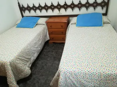 two beds sitting next to each other in a room at Mi playa in Puerto de Sagunto