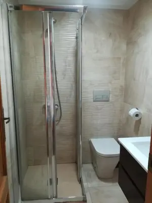 a bathroom with a shower and a toilet at Mi playa in Puerto de Sagunto
