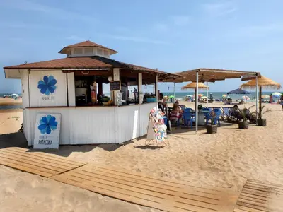 a beach bar on the beach with people sitting at Valencia Beach Home 23 in Valencia