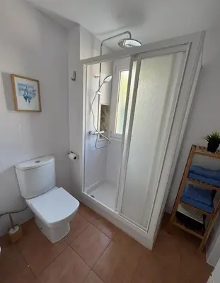 a bathroom with a shower and a toilet in it at Apartamento familiar en Cullera - Playa el Racó in Cullera
