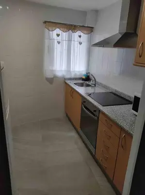 a small kitchen with a sink and a stove at Casa Coletor in Chulilla