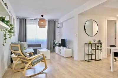 a living room with a couch and a table at SPACIOUS, SUNNY FLAT BY CITY OF ARTS & SCIENCES in Valencia