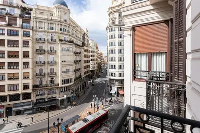 a room with a view of a city with buildings at BUBUFLATS Ayuntamiento in Valencia