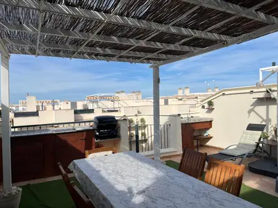 a patio with a table and chairs on a balcony at PLAYA ALMENARA ATICO DUPLEX VISTAS AL MAR Y MONTAÑA WIFI,PISCINA a in Almenara