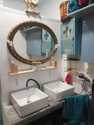 a bathroom with two white sinks and a mirror at veronica in Llaurí