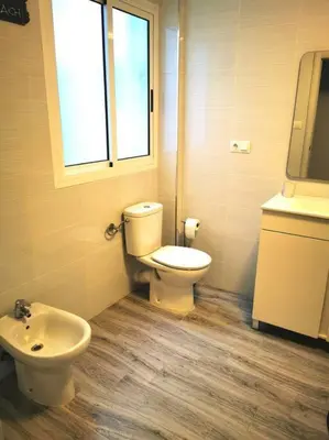 a bathroom with a toilet and a sink at Great 4 bedrooms apartament in Puerto de Sagunto - Full Apartment - 120m2 in Puerto de Sagunto