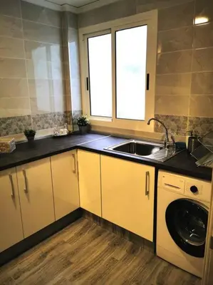 a kitchen with a sink and a washing machine at Great 4 bedrooms apartament in Puerto de Sagunto - Full Apartment - 120m2 in Puerto de Sagunto