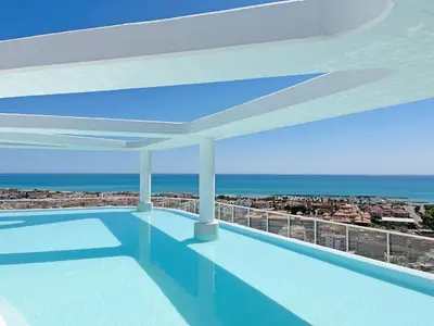 a swimming pool with a view of the ocean at Global Vacacional, Moderno apartamento con 2 terrazas y 3 habitaciones in Canet de Berenguer