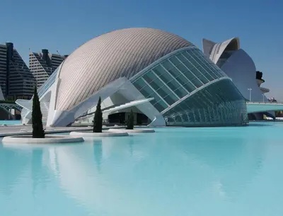 a building with a curved roof on top of water at NUEVO, a 50 metros de la playa y con vistas al mar in Cullera