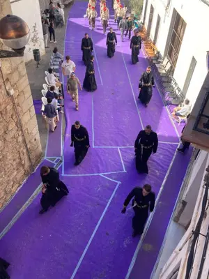 a group of people standing on a purple floor at Sagunto Castillo 17 in Sagunto