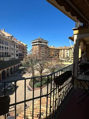 a balcony with a view of a city with buildings at Port Saplaya 3 habitaciones Valencia in Port Saplaya