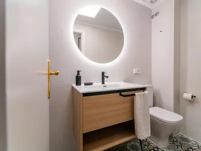 a bathroom with a sink and a mirror at MD Iturbi Jardin Turia in Valencia
