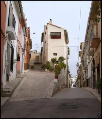 an alley with a building in the middle of a street at Mountain Retreat with stunning terrace views in Pedralba