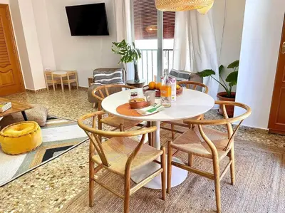 a white table and chairs in a living room at Mountain Retreat with stunning terrace views in Pedralba