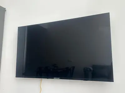 a flat screen tv hanging on a wall at Beach Apartments Valencia in Valencia