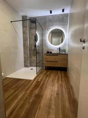 a bathroom with a shower and a sink and a mirror at Beach Apartments Valencia in Valencia