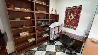 a office with a desk and a chair in a room at flat family near center and jardin turia avenida del cid in Valencia