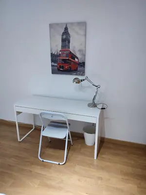 a white desk with a lamp and a picture of a bus at Bedroom to rent in the beach in Valencia