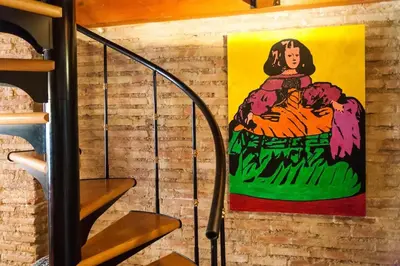 a painting of a woman on a wall at Attic Duplex Ruzafa in Valencia