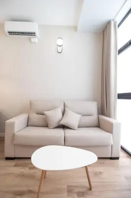 a living room with a couch and a table at Maritim 2 by Concept Flats in Valencia