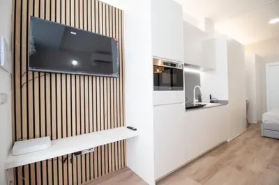 a living room with a tv on a wall at Maritim 2 by Concept Flats in Valencia