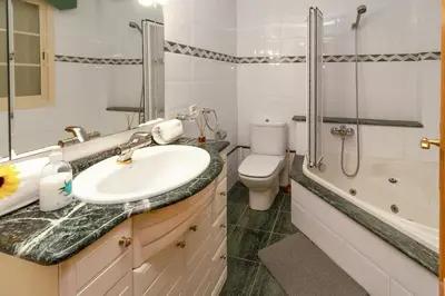 a bathroom with a sink and a toilet and a shower at GuestReady - A un paso del Mediterráneo in El Puig