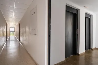 a bedroom with a large white bed with towels on it at Precioso apartamento en Canet Playa by Hometels in Canet de Berenguer