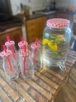 a group of small glass bottles with a fish in it at Casa Ellenita in Las Canteras