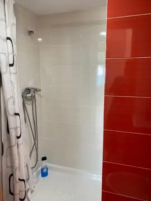 a bathroom with a shower with a shower curtain at Cara al mar in Cullera