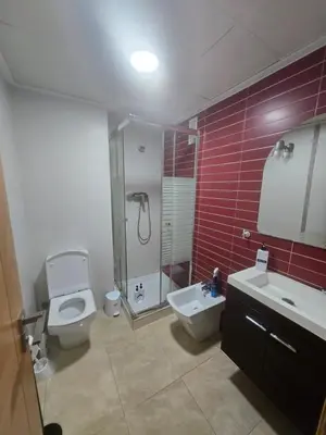 a bathroom with a toilet and a shower and a sink at Las Jarcias 3A in Moncófar