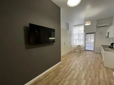 a living room with a flat screen tv on a wall at Rodrigues 15 in Valencia