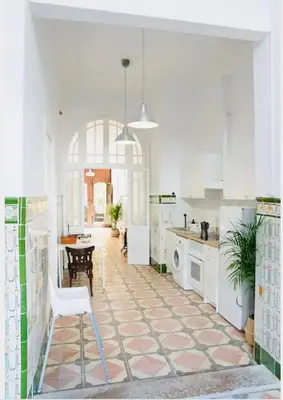 a kitchen with a table and a chair in it at Habitación doble en Ruzafa con baño privado in Valencia