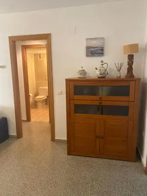 a room with a dresser with a toilet in a bathroom at Apartamento frente al mar en Playa Patacona in Valencia