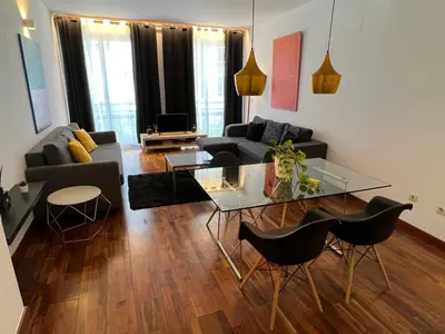 a living room with a couch and a table at Baron Suites in Valencia