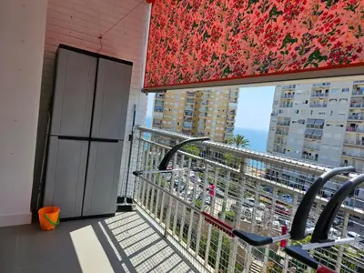 a balcony with a view of the ocean from a building at Apartamento a pie de playa I in Faro de Cullera