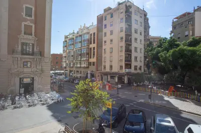a view of a city street with parked cars and buildings at SingularStays San Valero in Valencia