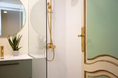 a shower with a glass door in a bathroom at SingularStays San Valero in Valencia