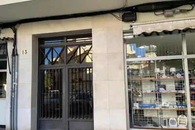 a store front with wrought iron doors and windows at SingularStays Gran Via in Valencia