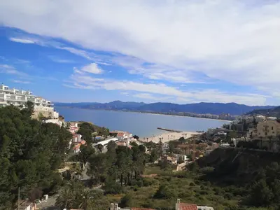 a view of a large body of water with buildings at Apartamentos Bon Amb in Faro de Cullera