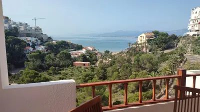 a view of the ocean from a balcony at Una casa con vistas in Faro de Cullera