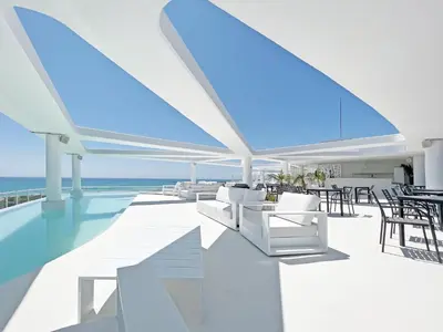 an open living room with a view of the ocean at Global Vacacional, Apartamento con terraza, vistas al mar y a la piscina in Canet de Berenguer