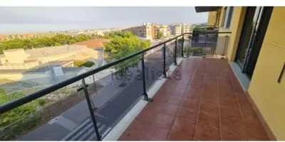 a balcony of a building with a view of a street at Vacaciones perfectas. in Paterna